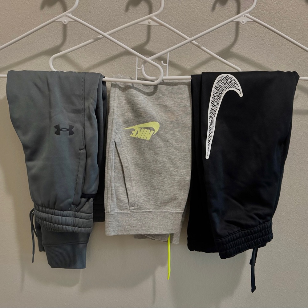 Boys size 10/12 joggers - Under Armour, Nike